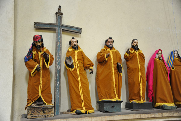 Carved statues of saints in handmade clothes which are replaced annually