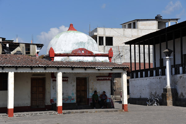 A small domed building at the northeast corner of Santiago Atitlan's main plaza