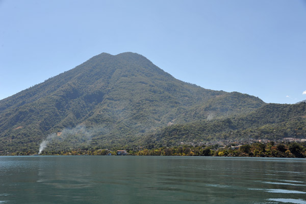 The village of San Pedro comes into sight at the foot of its volcano