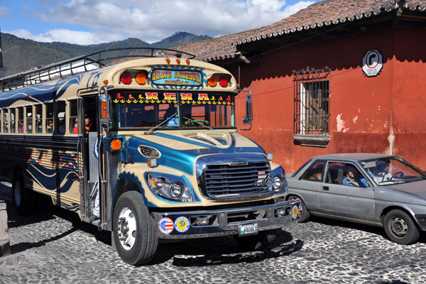One of the many painted up old school buses plying the route between Antigua and Guatemala City