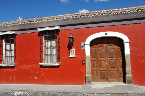 A red house typical of Antigua Guatemala, 1a Calle Ote