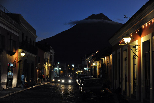 As night falls, Volcn de Agua is changed into a dark conical silhouette