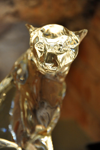 Modern glass sculpture of a jaguar