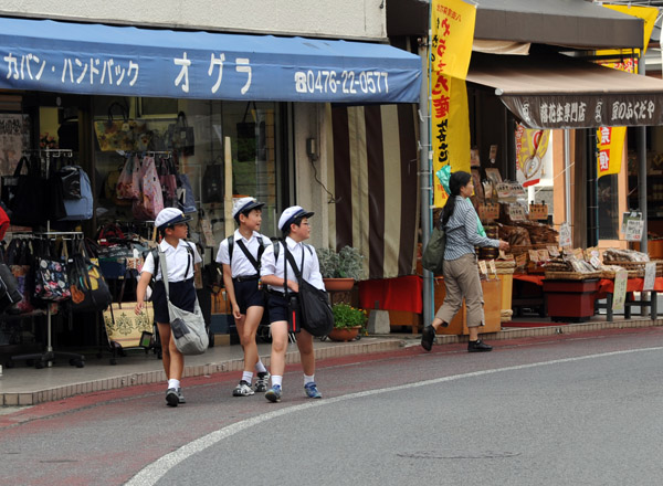 Japanese schoolboys walking home after school