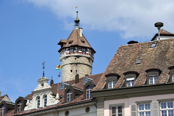Tower of Munot Fortress rising behind the riverside buildings, Schaffhausen