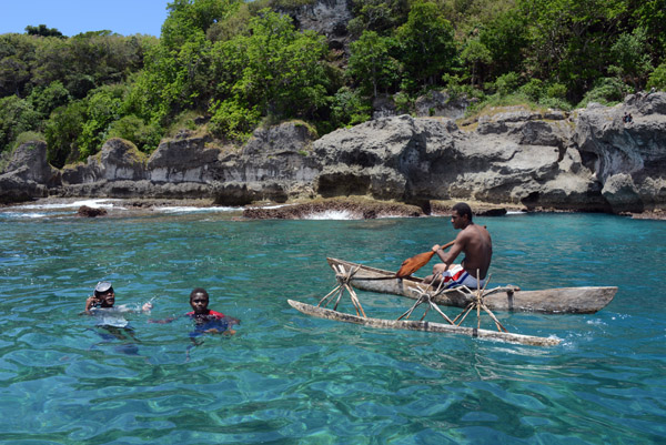 Outrigger canoe and local kids, Tanna-Vanuatu