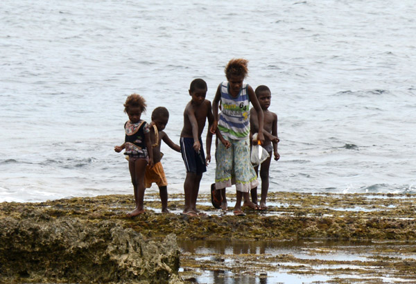 Kids near Lenakel searching the tide pools