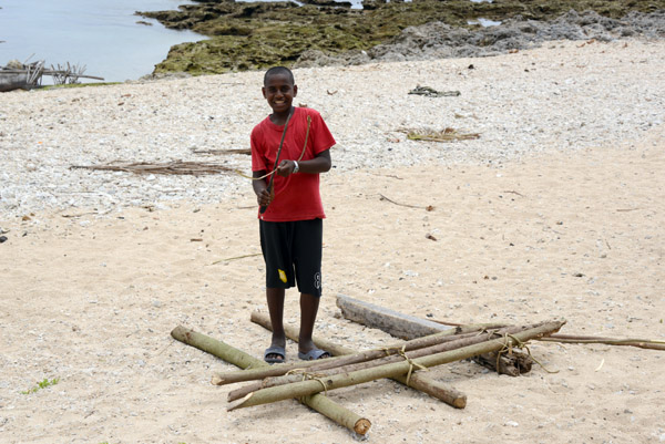 A boy starting construction on an outrigger