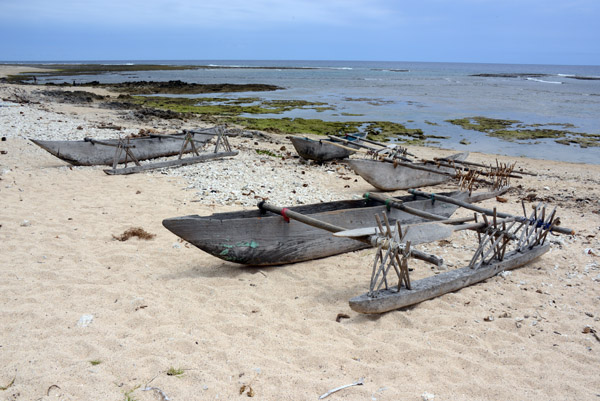 Outrigger canoes pulled up on the beach near Lenakel