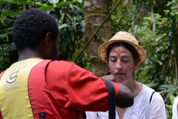 Face painting before descending into the cave