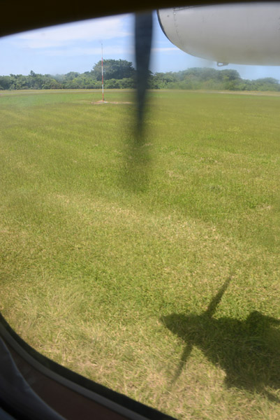 Taxiing across the grass to depart Runway 12 at Santo