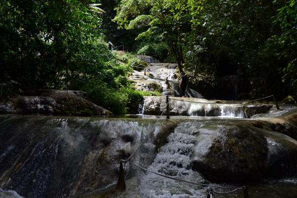 At the upper levels, the trail is cut out of the rocks in the stream itself