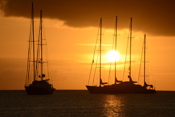 Two large sailing yachts at Port Vila, sunset
