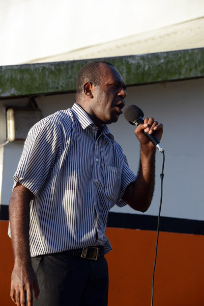Vanuatu politician giving a stump speech behind the market