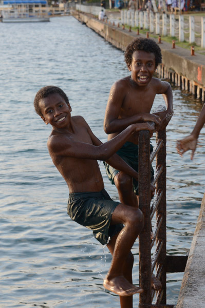 Boys climbing out of the water