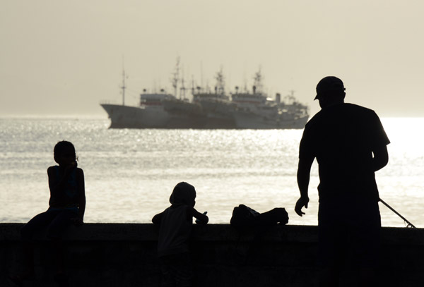 Fisherman with kids on the seawall, Suwa waterfront