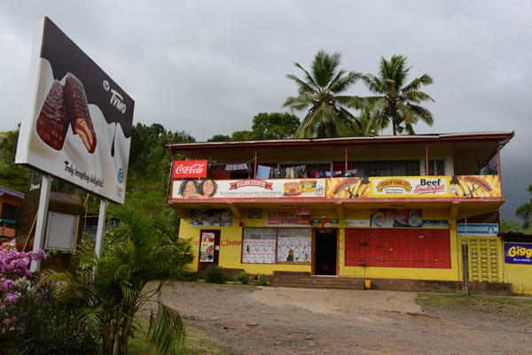 R.R. Rao & Sons store covered with advertising, Kings Rd