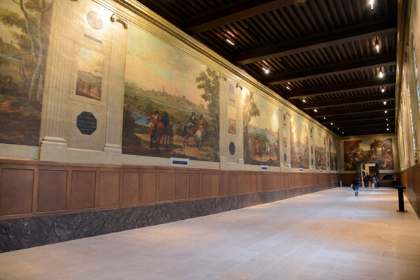 Corridor with large paintings of various fortified cities in the Netherlands and nearby Rhineland
