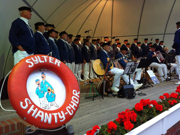 Sylter Shanty-Chor performing at the Musikmuschel, Westerland