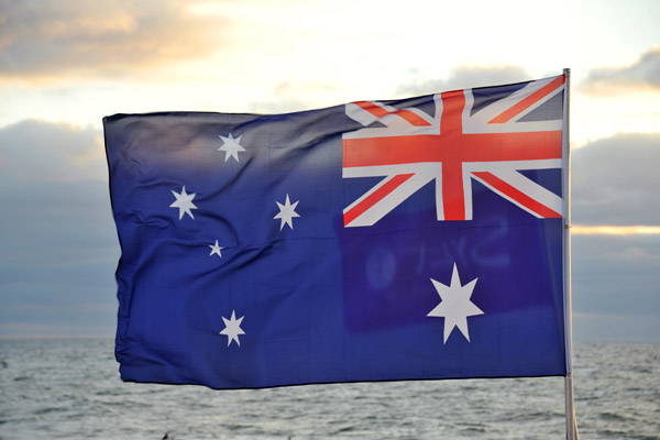 Australian flag blowing in the stiff North Sea wind, Sylt