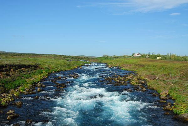 Crossing a crystal clear stream at Gýgjarhóll on Route 30