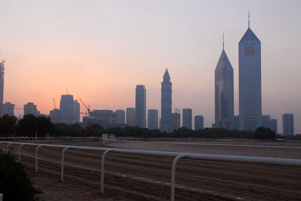 Sheikh Zayed Road at dusk from across the horse race track at Za'abeel