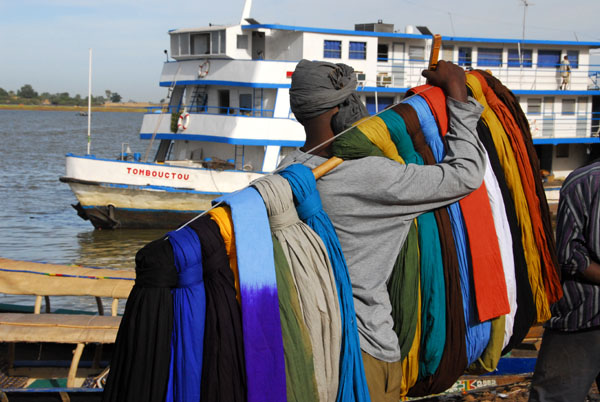 Man selling turbans, Mopti riverfront