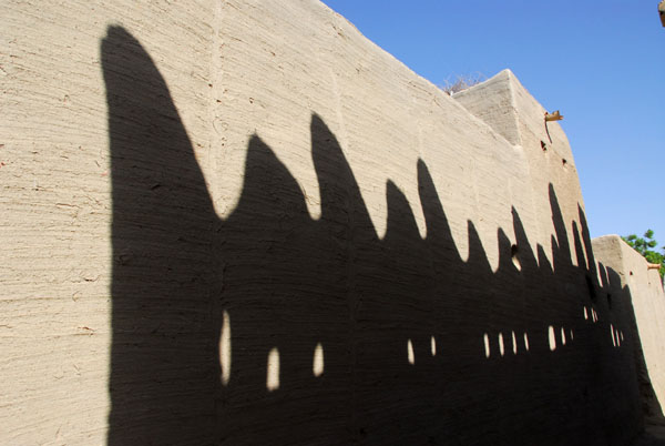 Shadow of the roofline of a Sudanese-style mudbrick building, Kotaka