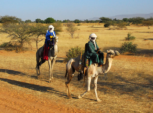 Men mounted on camels along the Timbuktu track