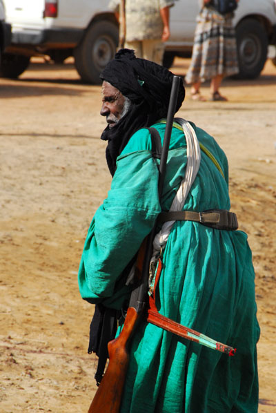Tuareg chief with sword and rifle