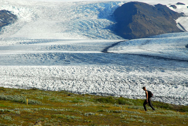 Hiker with the Skaftafellsjkull, a small glacier descending from the massive Vatnajkull Icecap