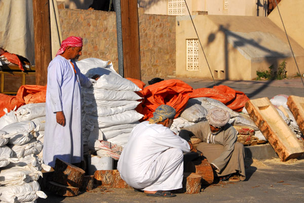 Omani men carving at the Nizwa souq
