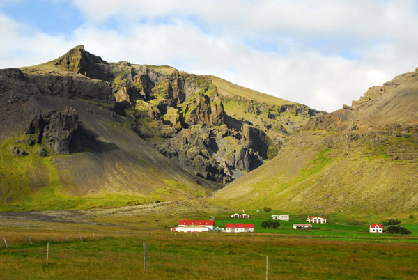 Remote farms wedged between the mountains and the ocean, SE Iceland