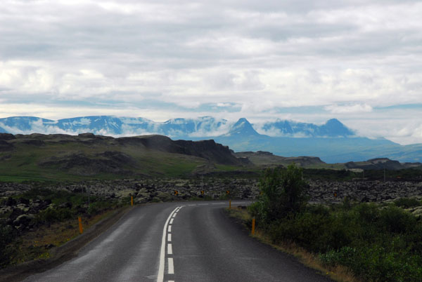 Langjkull rising in the distance from the Ring Road, southbound nearing Borgarnes
