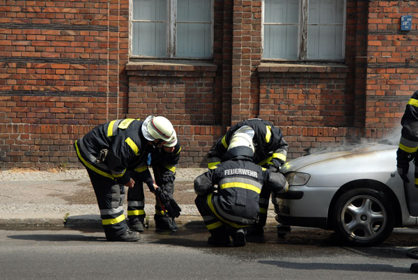 Berlin firefighters extinguish a car fire