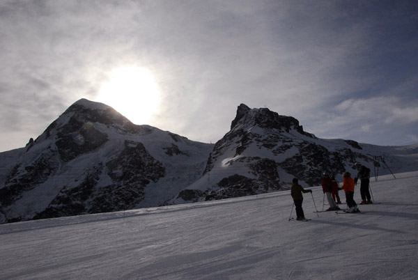 Skiers with a low sun, Zermatt