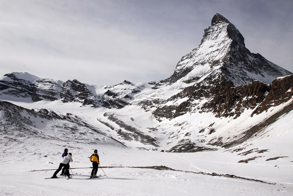 Skiers admiring the Matterhorn. It doesn't look that big from here...