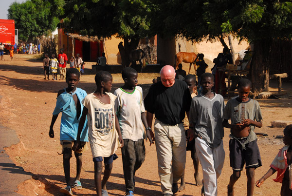 Boys from the village walking with Hubertus