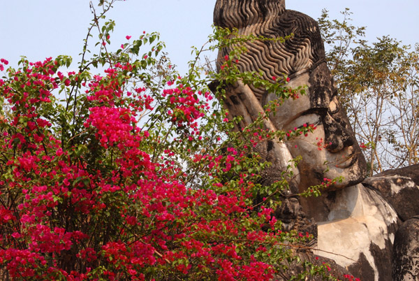 Reclining Buddha with red flowers, Buddha Park
