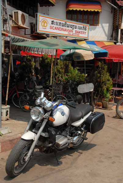 Motorcycle parked in front of the Scandinavian Bakery, Vientiane