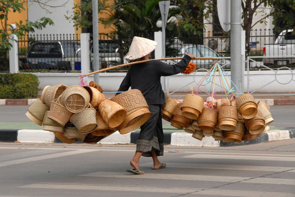 Lao woman with baskets to sell