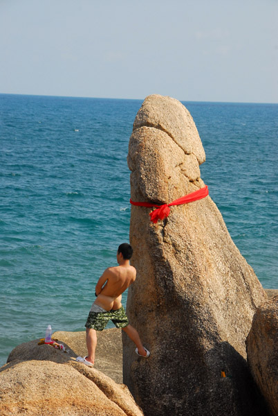 Asian tourist sizing himself up...