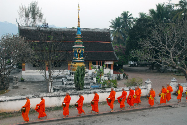 Monks passing the temple across Thanon Xieng Thong from Sok Xai guesthouse