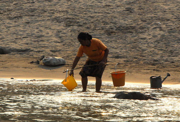 Woman fetching water from the Mekong