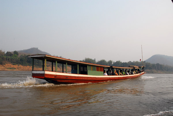 Boatload of tourists heading up the Mekong to Buddha Cave