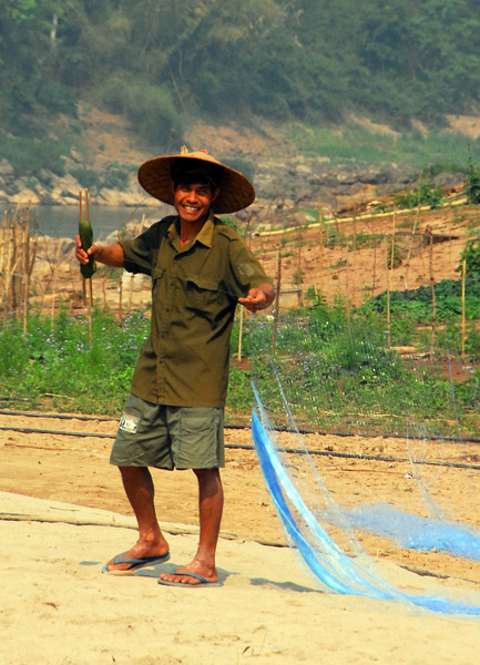Man preparing his nets, Ban Xang Hai
