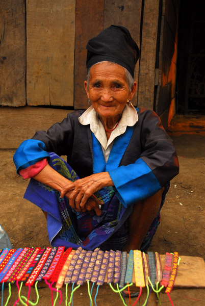 Old Mong woman selling hand-made bracelets