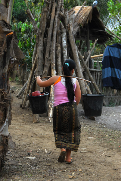 Mong woman carrying water