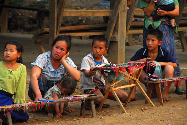 Villagers with items to sell to tourists