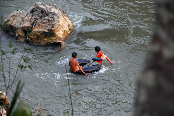 Lao boys with tubing down the Nam Khan River, Luang Prabang